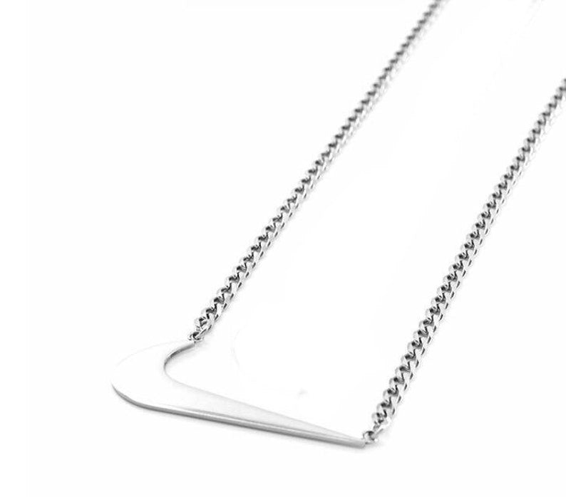 silver nike necklace